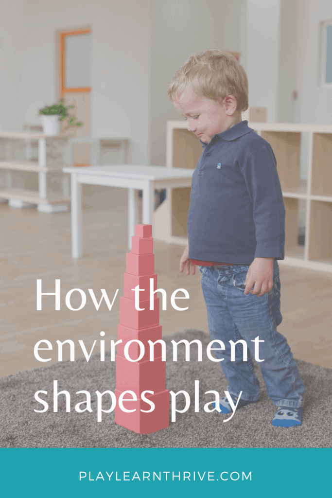 Play is impacted by your childs environment and how much they get out of it. A little boy stands on a gray shag run looking down and a wooden block tower he just built.