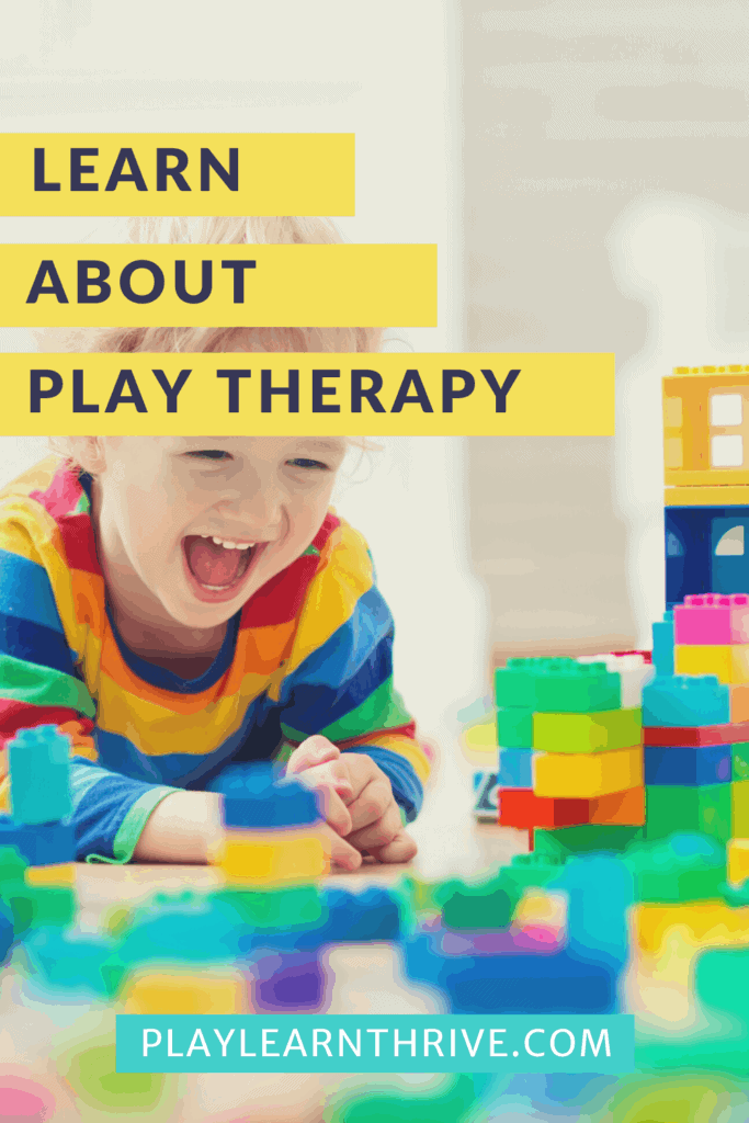 A boy plays with blocks on the floor of all different colors exploring play therapy.