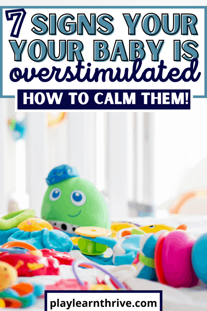 A close up of infant toys lays on a white rug showing a cluttered mess that leads to infant overwhelm and over stimulation.