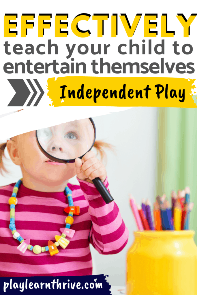 A little girl in a pink and red stripped shirt holds a magnifying glass up to her eye exploring independent play on her own learning how to play by herself.