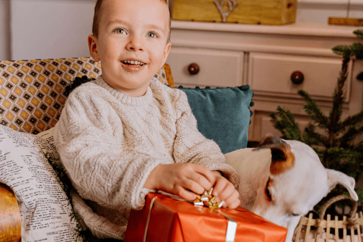white male toddler opening present