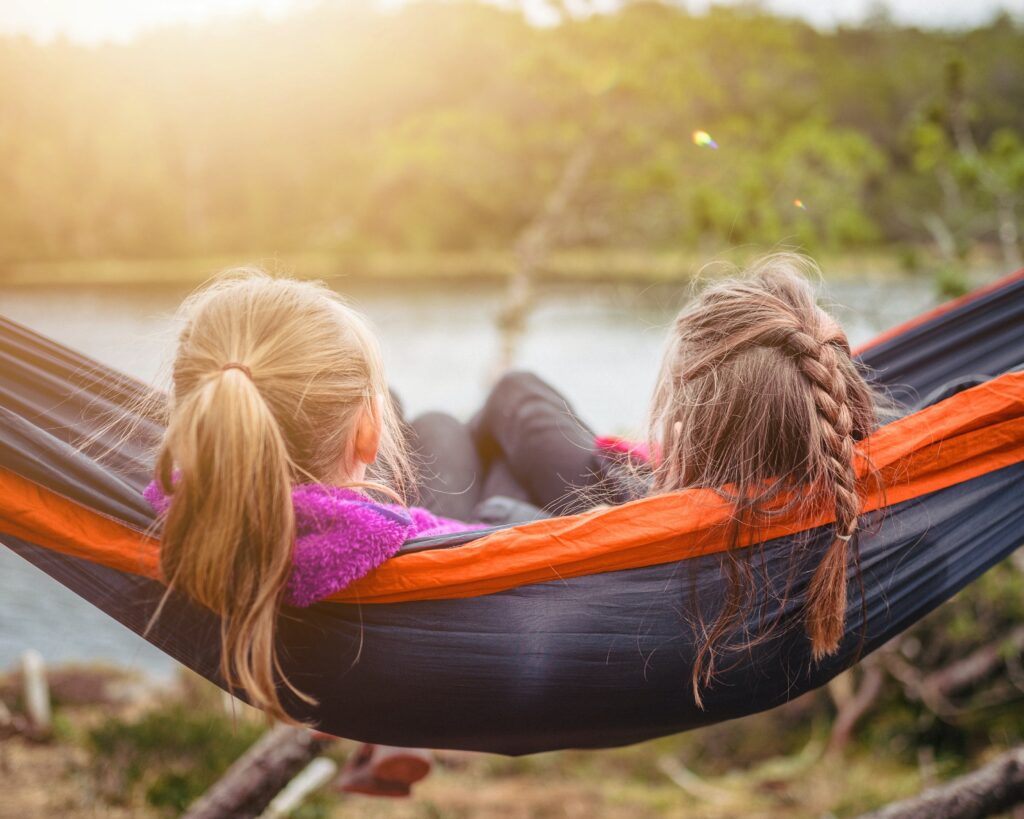 Kids sharing hammock